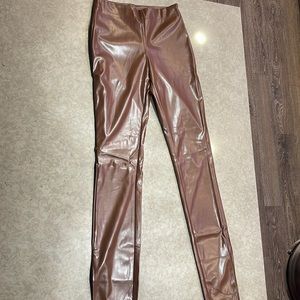 Brown leather pants.